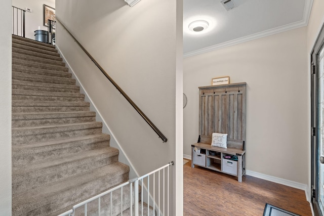 3228 Mcmillan Creek Dr, Milton, FL 32583 - staircase with ornamental molding and wood finished floors