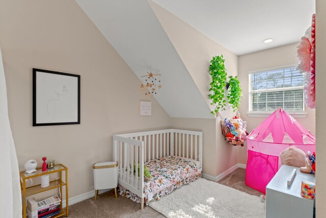3228 Mcmillan Creek Dr, Milton, FL 32583 - bedroom featuring carpet flooring, a nursery area, and vaulted ceiling
