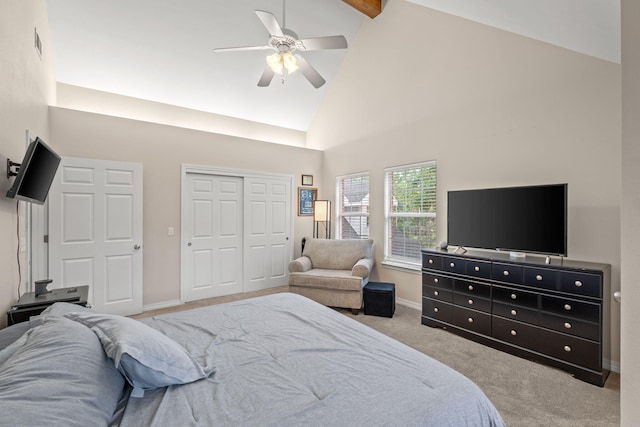 3228 Mcmillan Creek Dr, Milton, FL 32583 - bedroom with high vaulted ceiling, carpet floors, a closet, a ceiling fan, and beam ceiling