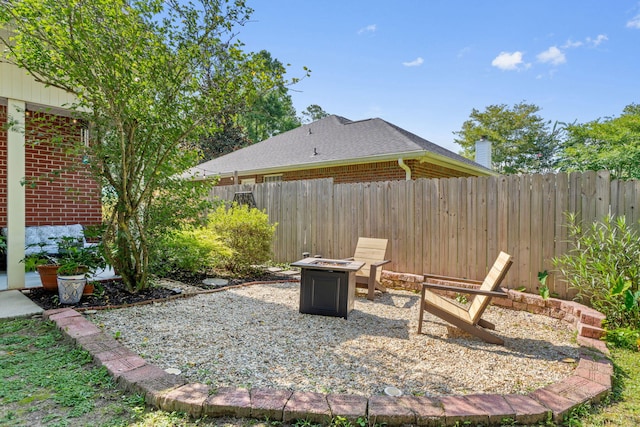 3228 Mcmillan Creek Dr, Milton, FL 32583 - view of patio / terrace with a fire pit