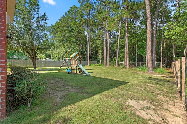3228 Mcmillan Creek Dr, Milton, FL 32583 - fenced backyard featuring a playground