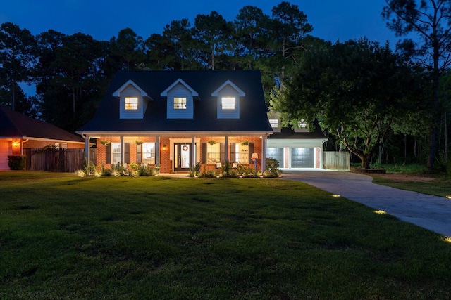 3228 Mcmillan Creek Dr, Milton, FL 32583 - cape cod house featuring driveway, a garage, a porch, and brick siding