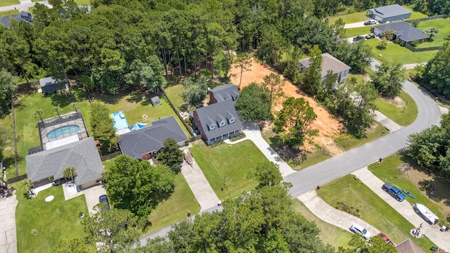 3228 Mcmillan Creek Dr, Milton, FL 32583 - aerial overview of property's location featuring a pool area and nearby suburban area