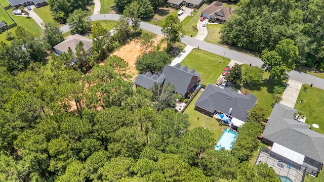 3228 Mcmillan Creek Dr, Milton, FL 32583 - aerial overview of property's location with nearby suburban area and a pool