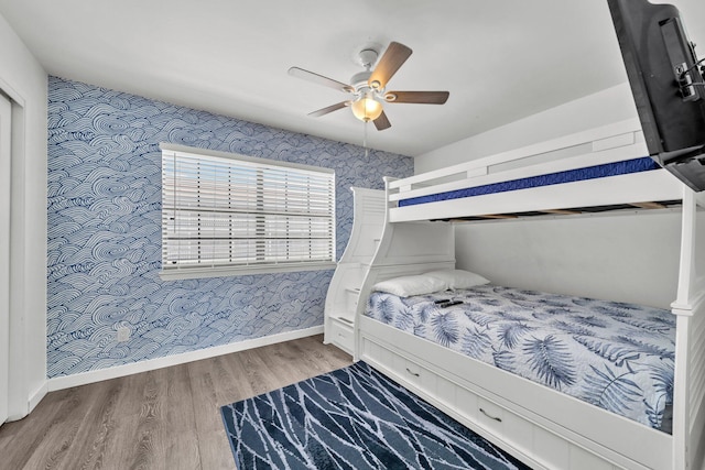 115 Gulf Winds Ct Unit 2, Destin, FL 32541 - bedroom featuring wallpapered walls, wood finished floors, and ceiling fan