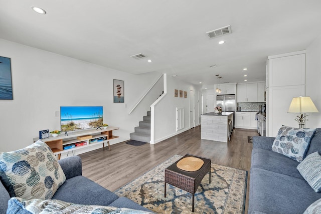 115 Gulf Winds Ct Unit 2, Destin, FL 32541 - living room featuring dark wood-style flooring, stairway, and recessed lighting
