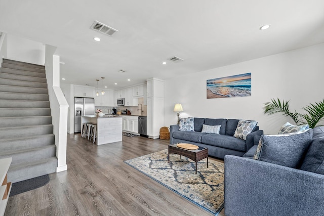 115 Gulf Winds Ct Unit 2, Destin, FL 32541 - living area with stairs, recessed lighting, and dark wood-style floors