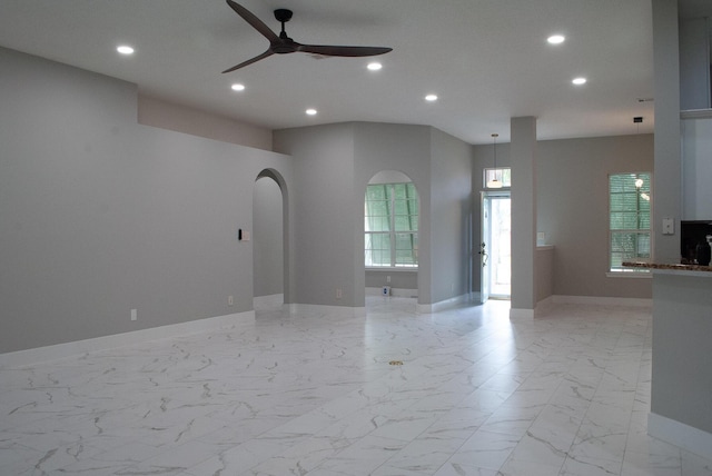 4906 Laurel Oak Dr, Pace, FL 32571 - spare room with recessed lighting, a ceiling fan, light marble finish flooring, and arched walkways