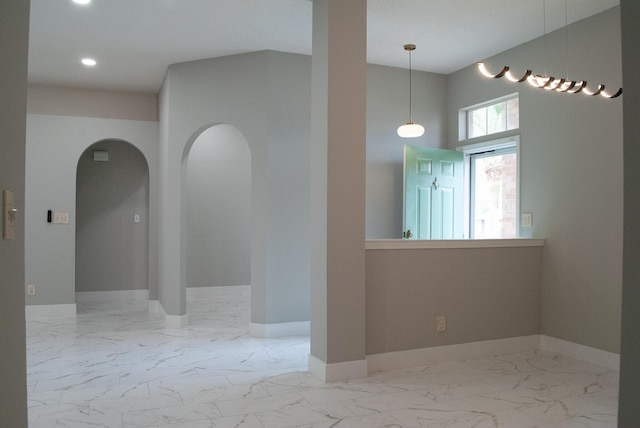 4906 Laurel Oak Dr, Pace, FL 32571 - unfurnished room featuring arched walkways, marble finish floors, and recessed lighting