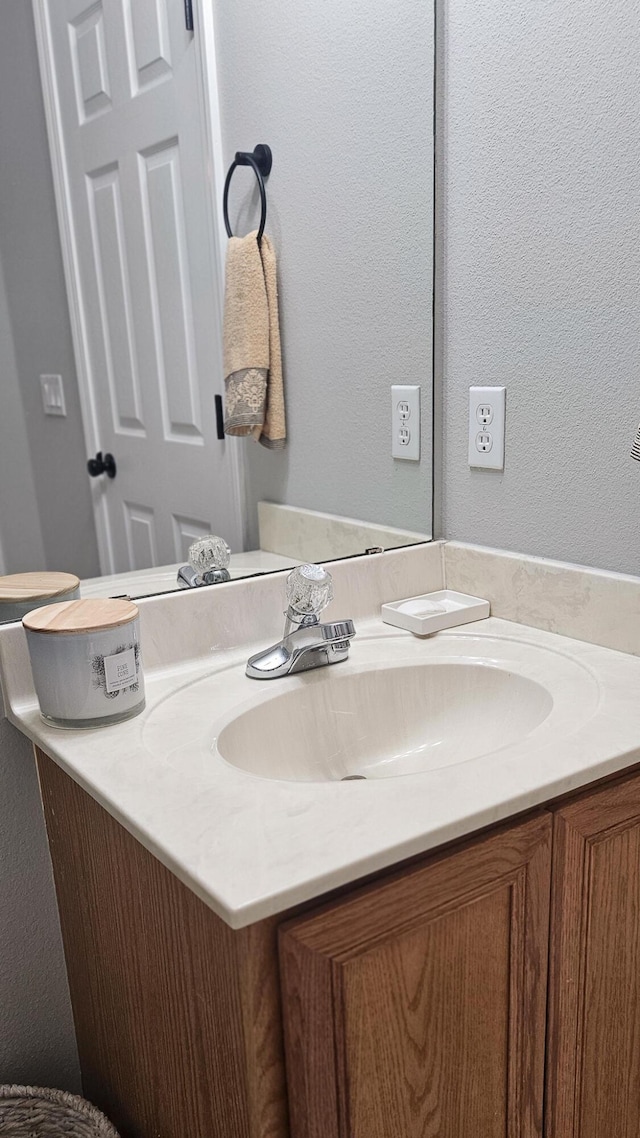 4906 Laurel Oak Dr, Pace, FL 32571 - bathroom with vanity and a textured wall