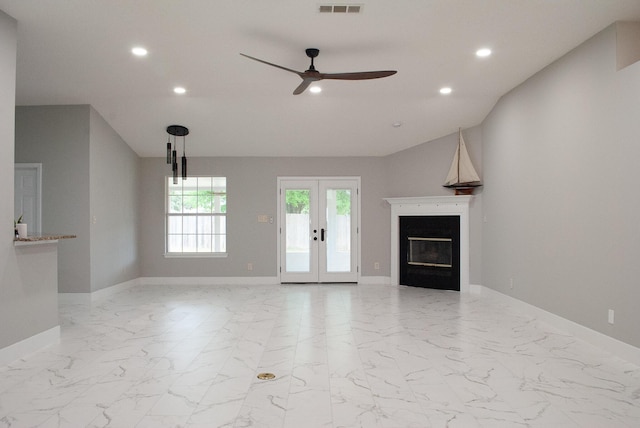 4906 Laurel Oak Dr, Pace, FL 32571 - unfurnished living room featuring recessed lighting, ceiling fan, light marble finish floors, a glass covered fireplace, and french doors