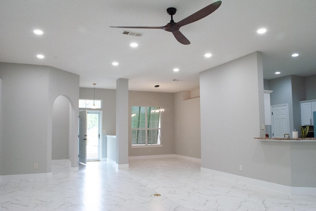 4906 Laurel Oak Dr, Pace, FL 32571 - unfurnished living room featuring recessed lighting, light marble finish flooring, ceiling fan, and arched walkways