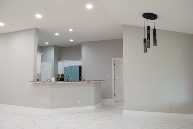 4906 Laurel Oak Dr, Pace, FL 32571 - kitchen featuring freestanding refrigerator, light marble finish floors, recessed lighting, and white cabinets