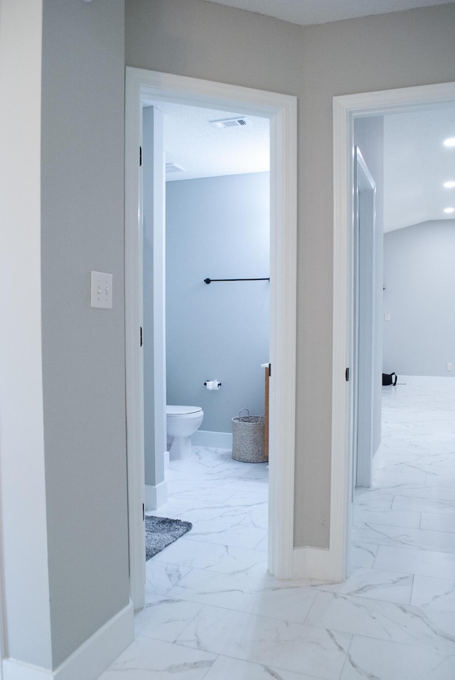 4906 Laurel Oak Dr, Pace, FL 32571 - bathroom with marble look tile flooring and toilet