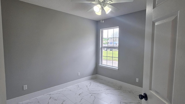 4906 Laurel Oak Dr, Pace, FL 32571 - unfurnished room with marble look tile flooring and a ceiling fan