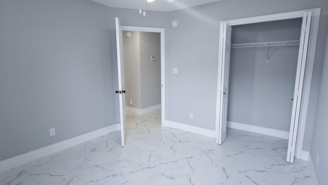 4906 Laurel Oak Dr, Pace, FL 32571 - unfurnished bedroom featuring marble look tile flooring and a closet
