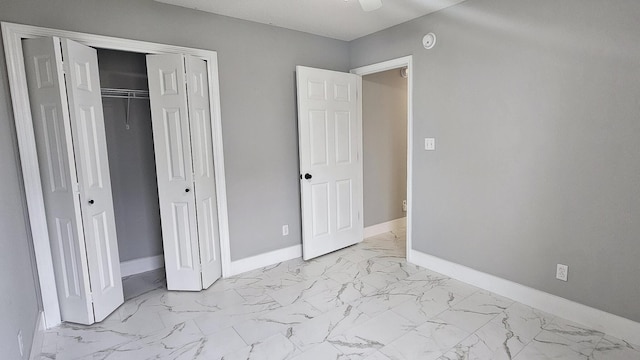 4906 Laurel Oak Dr, Pace, FL 32571 - unfurnished bedroom with light marble finish floors and a closet