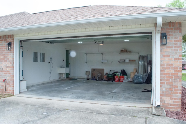4906 Laurel Oak Dr, Pace, FL 32571 - garage featuring concrete driveway and a garage door opener