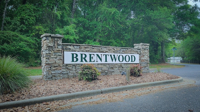 4906 Laurel Oak Dr, Pace, FL 32571 - community / neighborhood sign with a wooded view
