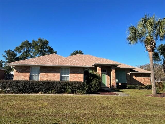 4906 Laurel Oak Dr, Pace, FL 32571 - view of front of home with a front yard and brick siding