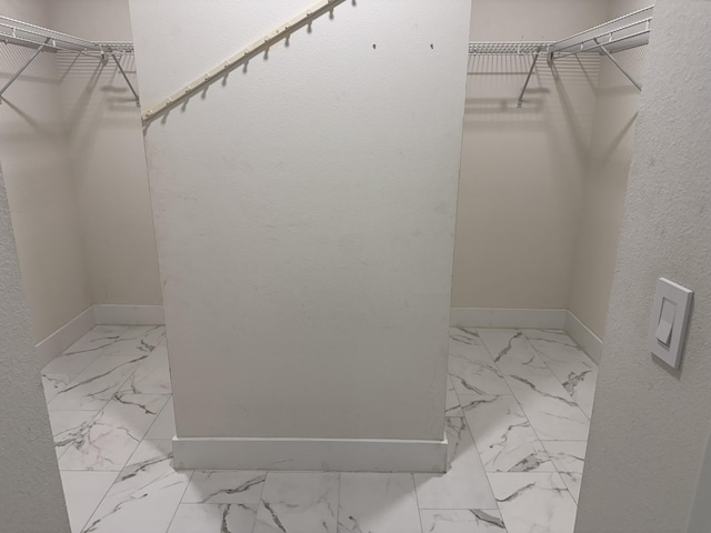 4906 Laurel Oak Dr, Pace, FL 32571 - walk in closet with marble finish floors