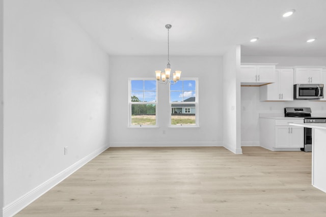 785 Alleyoak Ln Lot 86-1, Freeport, FL 32439 - kitchen with stainless steel appliances, white cabinets, a chandelier, recessed lighting, and light wood-style flooring