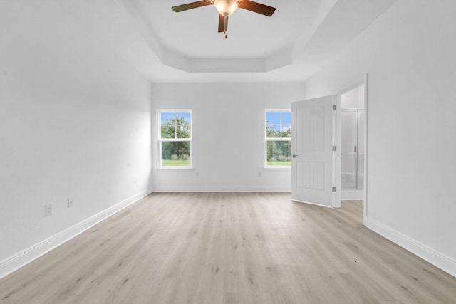 785 Alleyoak Ln Lot 86-1, Freeport, FL 32439 - empty room with a tray ceiling, light wood-type flooring, and a ceiling fan