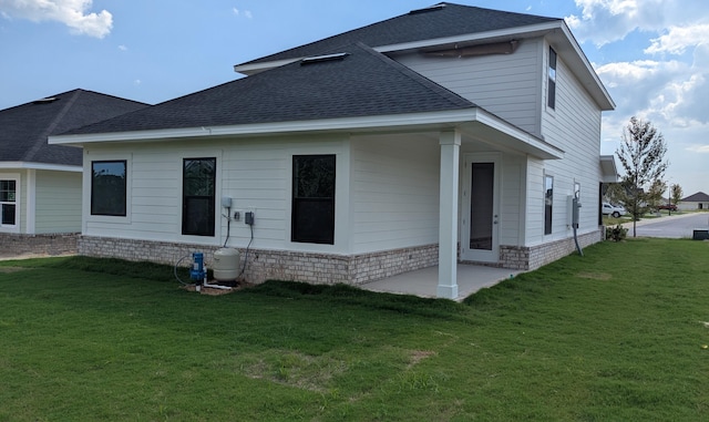 785 Alleyoak Ln Lot 86-1, Freeport, FL 32439 - rear view of property with a shingled roof and a yard