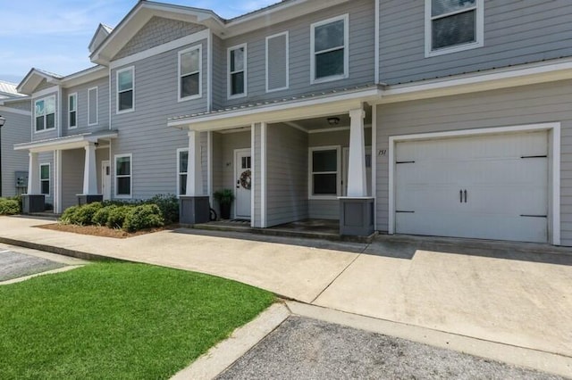 151 N Sand Palm Rd Unit 151, Freeport, FL 32439 - view of property with concrete driveway and a garage