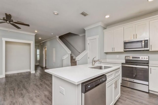 151 N Sand Palm Rd Unit 151, Freeport, FL 32439 - kitchen featuring appliances with stainless steel finishes, crown molding, recessed lighting, open floor plan, and light countertops