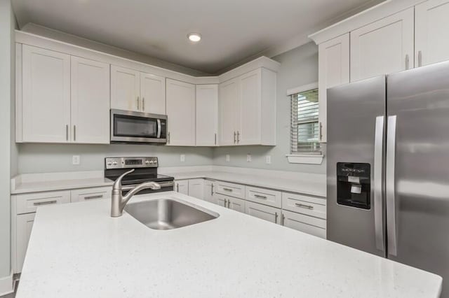 151 N Sand Palm Rd Unit 151, Freeport, FL 32439 - kitchen featuring appliances with stainless steel finishes, white cabinets, and recessed lighting