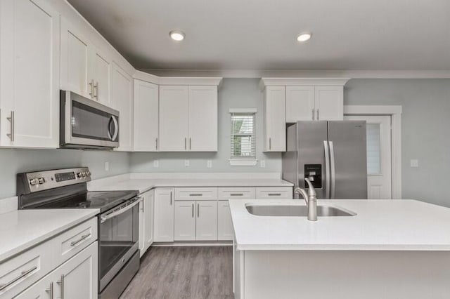 151 N Sand Palm Rd Unit 151, Freeport, FL 32439 - kitchen featuring stainless steel appliances, white cabinets, light countertops, and recessed lighting