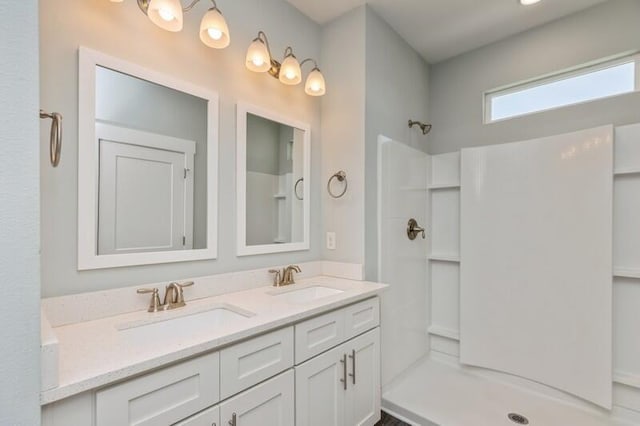 151 N Sand Palm Rd Unit 151, Freeport, FL 32439 - bathroom featuring double vanity and a shower