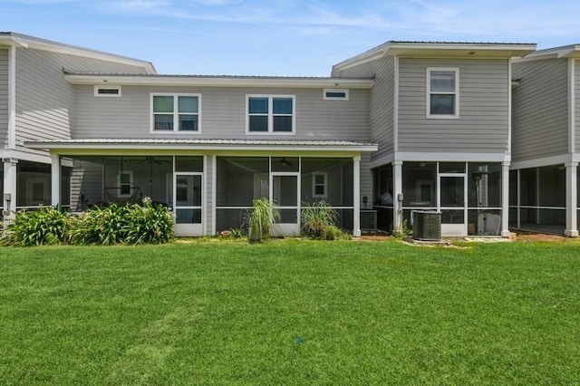 151 N Sand Palm Rd Unit 151, Freeport, FL 32439 - rear view of property featuring a sunroom, a yard, and a ceiling fan