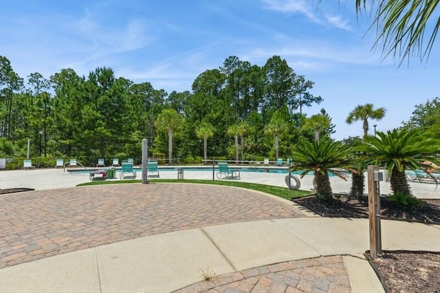 151 N Sand Palm Rd Unit 151, Freeport, FL 32439 - view of property's community with a pool and a patio area