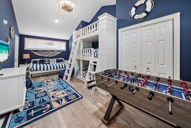 72 Vantage Pt, Miramar Beach, FL 32550 - bedroom with wood finished floors, vaulted ceiling, and a closet