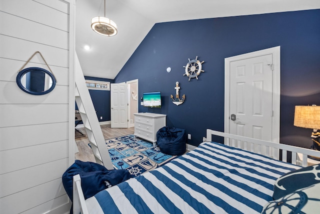 72 Vantage Pt, Miramar Beach, FL 32550 - bedroom with vaulted ceiling and wood finished floors