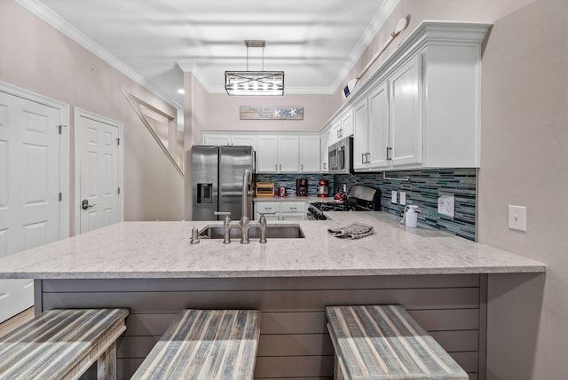 72 Vantage Pt, Miramar Beach, FL 32550 - kitchen featuring stainless steel appliances, a peninsula, tasteful backsplash, white cabinets, and light stone counters