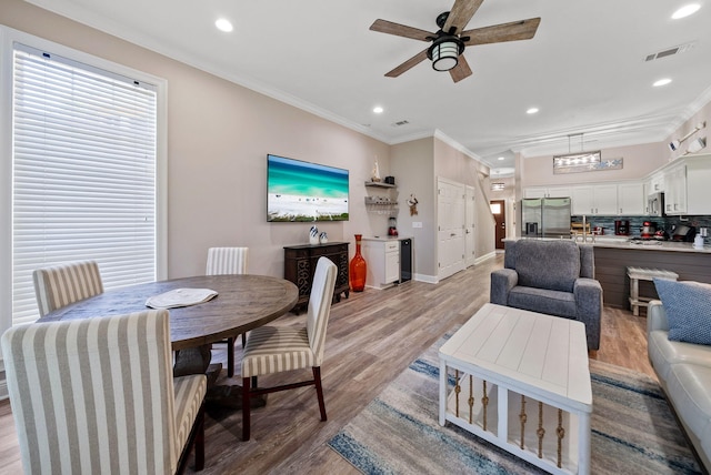 72 Vantage Pt, Miramar Beach, FL 32550 - dining space featuring recessed lighting, ceiling fan, light wood finished floors, and crown molding