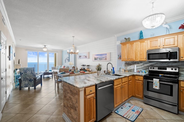 17643 Front Beach Rd Unit 1905, Panama City Beach, FL 32413 - kitchen featuring appliances with stainless steel finishes, a chandelier, ornamental molding, light tile patterned flooring, and decorative backsplash