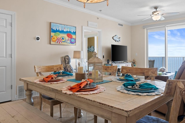 17643 Front Beach Rd Unit 1905, Panama City Beach, FL 32413 - dining room with ornamental molding and ceiling fan