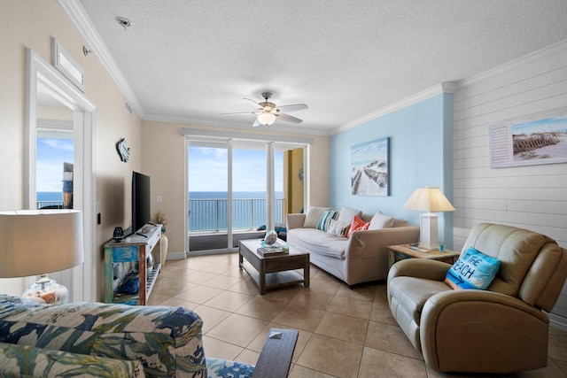 17643 Front Beach Rd Unit 1905, Panama City Beach, FL 32413 - living area featuring ceiling fan, crown molding, wooden walls, light tile patterned flooring, and a textured ceiling