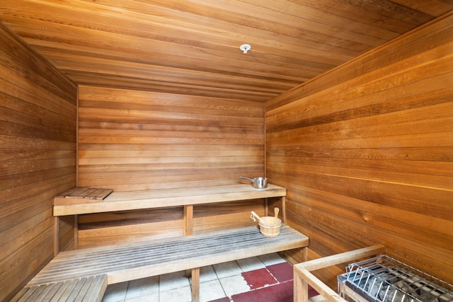 17643 Front Beach Rd Unit 1905, Panama City Beach, FL 32413 - relaxing sauna with tile patterned flooring, wooden walls, and wooden ceiling