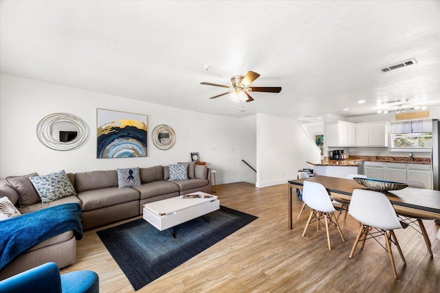 926 Whelk Ct Unit C, Fort Walton Beach, FL 32548 - living area with light wood-type flooring, ceiling fan, recessed lighting, and a textured ceiling