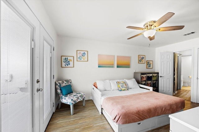 926 Whelk Ct Unit C, Fort Walton Beach, FL 32548 - bedroom with light wood finished floors, ceiling fan, and ensuite bath