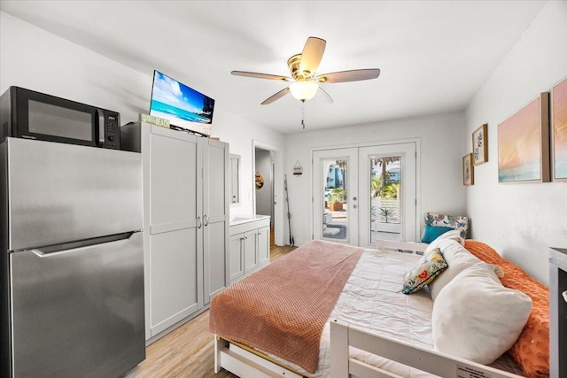 926 Whelk Ct Unit C, Fort Walton Beach, FL 32548 - bedroom with freestanding refrigerator, access to outside, french doors, light wood-style floors, and ceiling fan