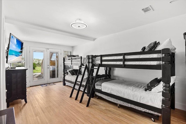 926 Whelk Ct Unit C, Fort Walton Beach, FL 32548 - bedroom with access to exterior, wood finished floors, and french doors