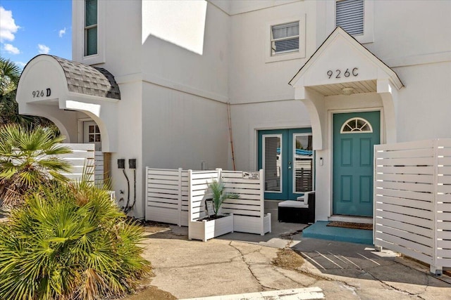 926 Whelk Ct Unit C, Fort Walton Beach, FL 32548 - doorway to property with french doors and stucco siding