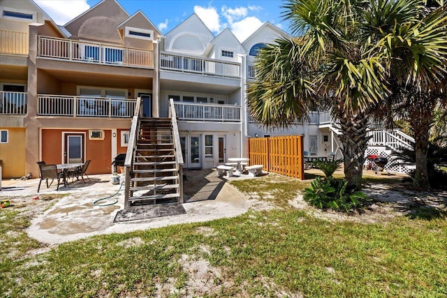 926 Whelk Ct Unit C, Fort Walton Beach, FL 32548 - rear view of property with stucco siding, a patio, and stairs
