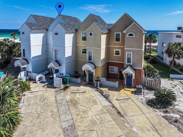 926 Whelk Ct Unit C, Fort Walton Beach, FL 32548 - view of front facade with stucco siding, a patio, and a water view